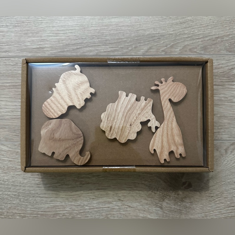 Four wooden animal hooks